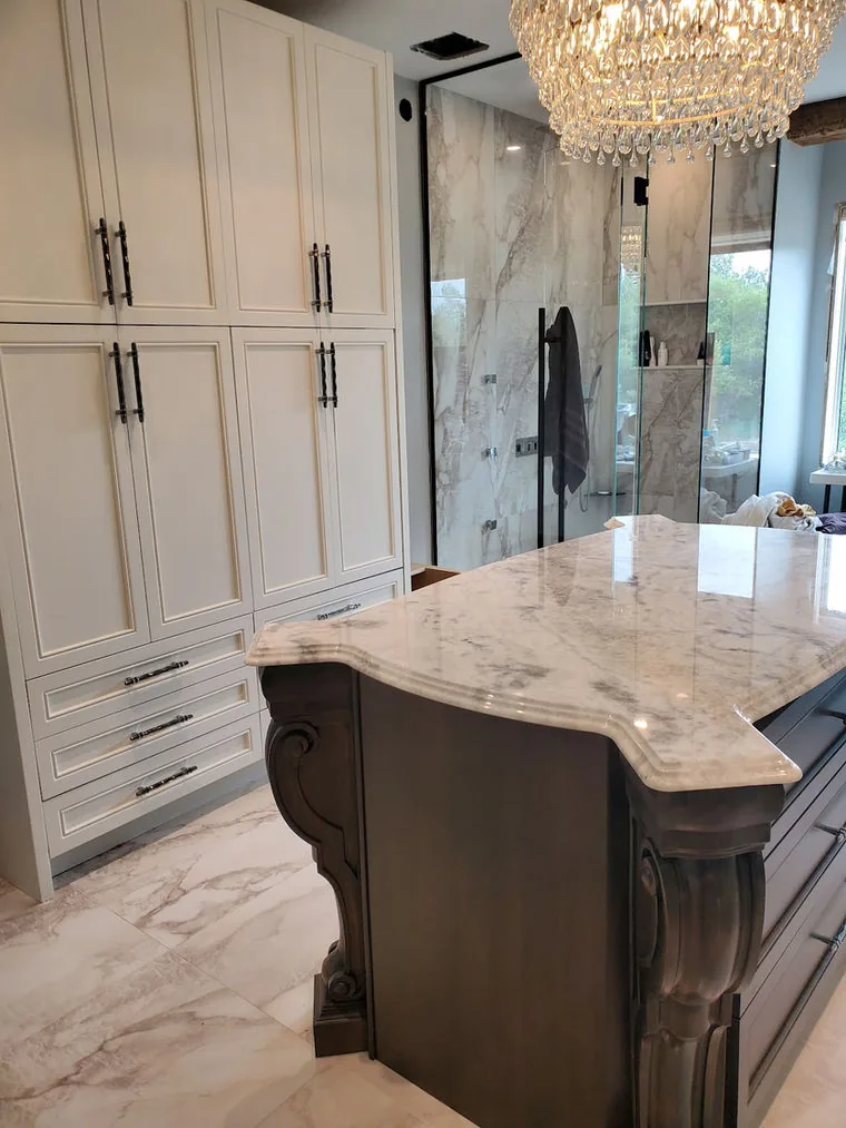 Leathered stone countertop with an ogee edge and a carved corbel detail