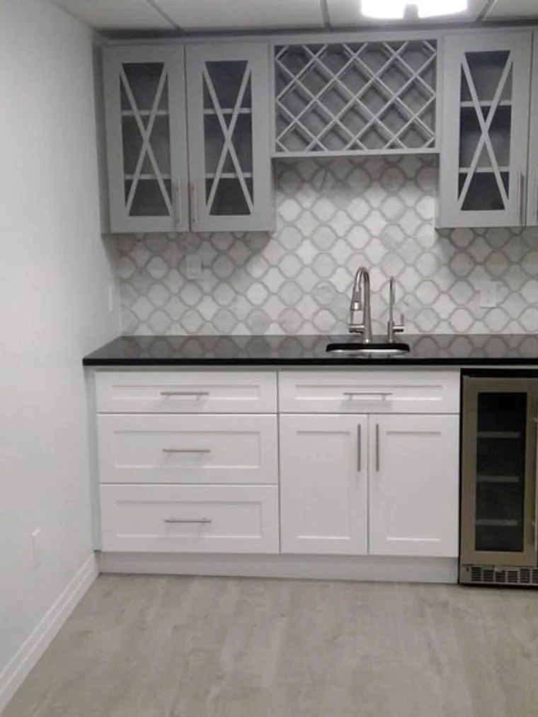 Kitchener basement bar with a wine fridge and lattice wine rack