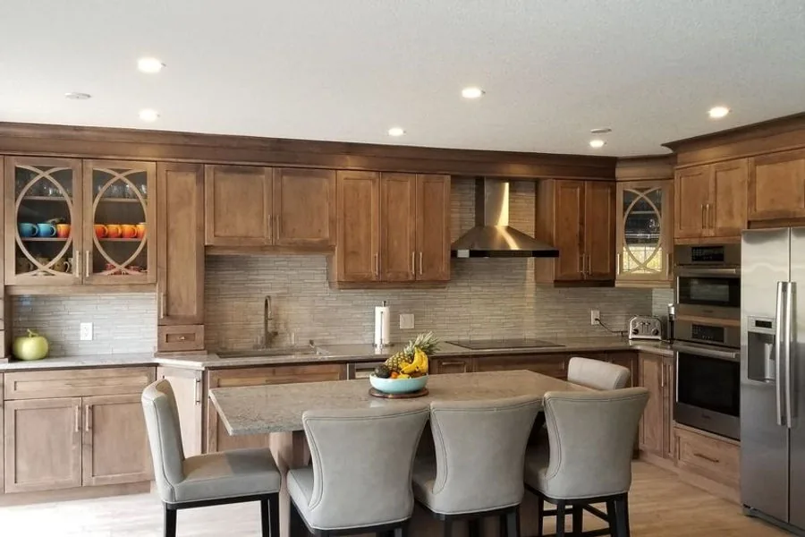 Modern Guelph kitchen with a natural wood finish and glass front upper cabinets